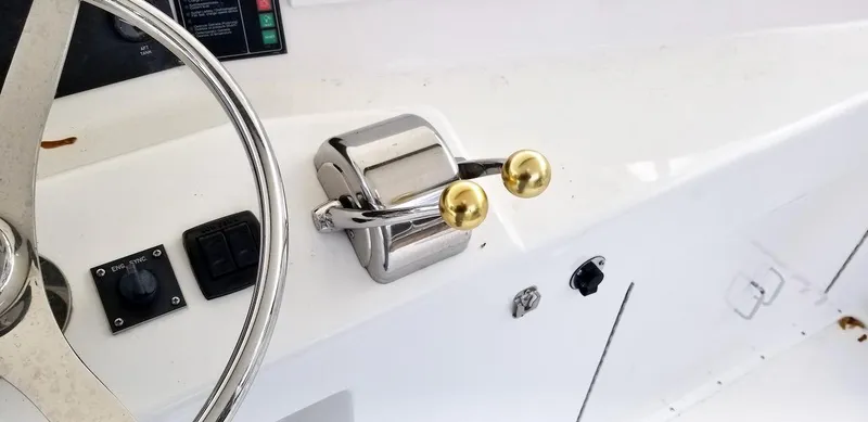 Irish Mist Yacht Photos Pics Boat steering wheel and throttle controls on a 2001 Post 50 Convertible.