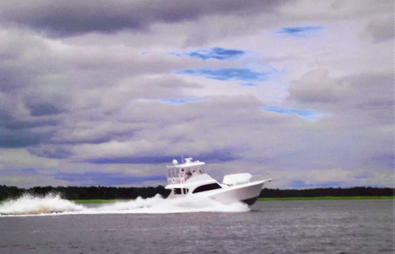 Irish Mist Yacht Photos Pics 2001 Post 50 Convertible yacht cruising on open water under cloudy skies.