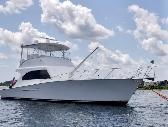 Irish Mist Yacht Photos Pics 2001 Post 50 Convertible yacht on water under cloudy sky.