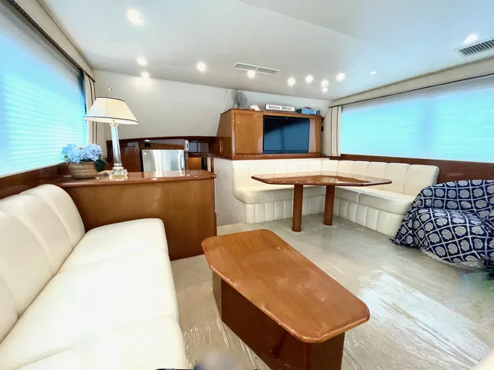 Irish Mist Yacht Photos Pics Luxurious interior of a 2001 Post 50 Convertible yacht with elegant seating and wooden furnishings.