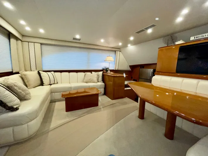 Irish Mist Yacht Photos Pics Luxurious interior of a 2001 Post 50 Convertible yacht with elegant seating and wooden accents.