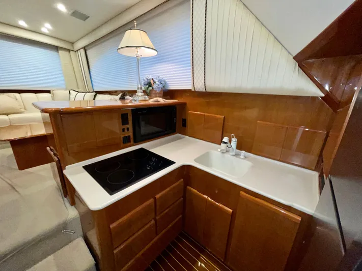 Irish Mist Yacht Photos Pics Luxurious kitchen area in a 2001 Post 50 Convertible yacht with modern amenities.
