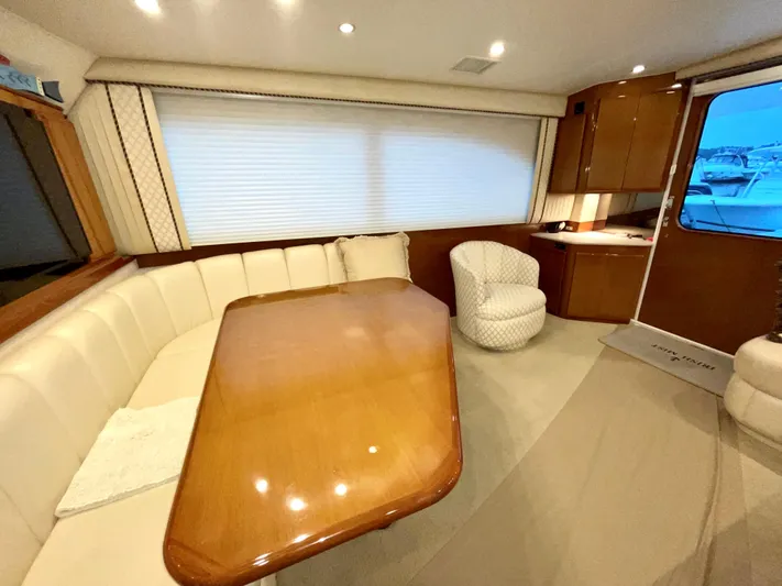 Irish Mist Yacht Photos Pics Interior of 2001 Post 50 Convertible yacht with dining area and plush seating.