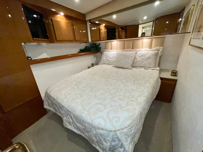 Irish Mist Yacht Photos Pics Luxurious bedroom interior of a 2001 Post 50 Convertible yacht with elegant bedding.