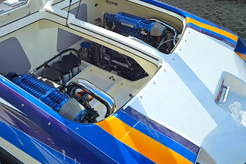  Yacht Photos Pics 2010 Daves Custom Boats M35 engine compartment with vibrant blue and orange accents.