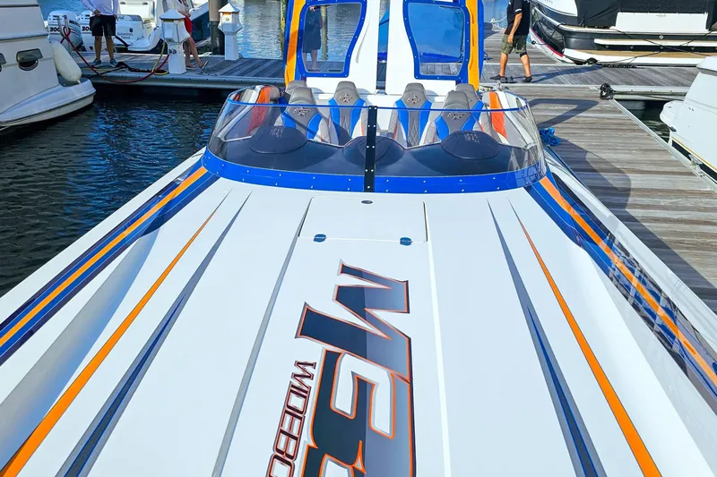  Yacht Photos Pics 2010 Daves Custom Boats M35 at dock, featuring sleek design and vibrant colors.