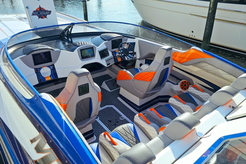  Yacht Photos Pics Interior of 2010 Daves Custom Boats M35 with vibrant seating and modern dashboard.