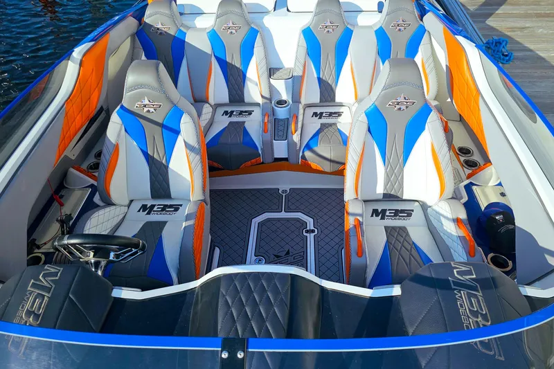  Yacht Photos Pics 2010 Daves Custom Boats M35 interior with vibrant blue, orange, and gray seating.