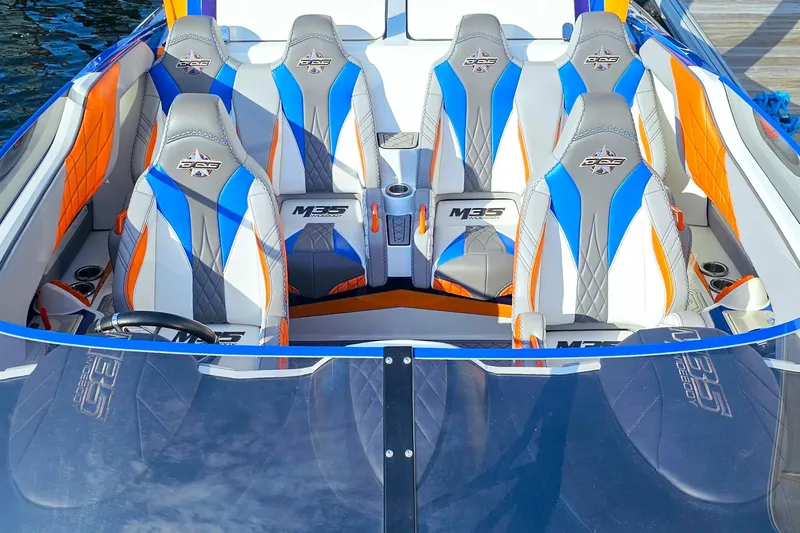  Yacht Photos Pics 2010 Daves Custom Boats M35 interior with vibrant blue, orange, and gray seating design.