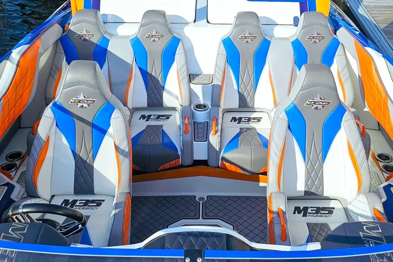  Yacht Photos Pics 2010 Daves Custom Boats M35 interior with blue, orange, and gray seating design.