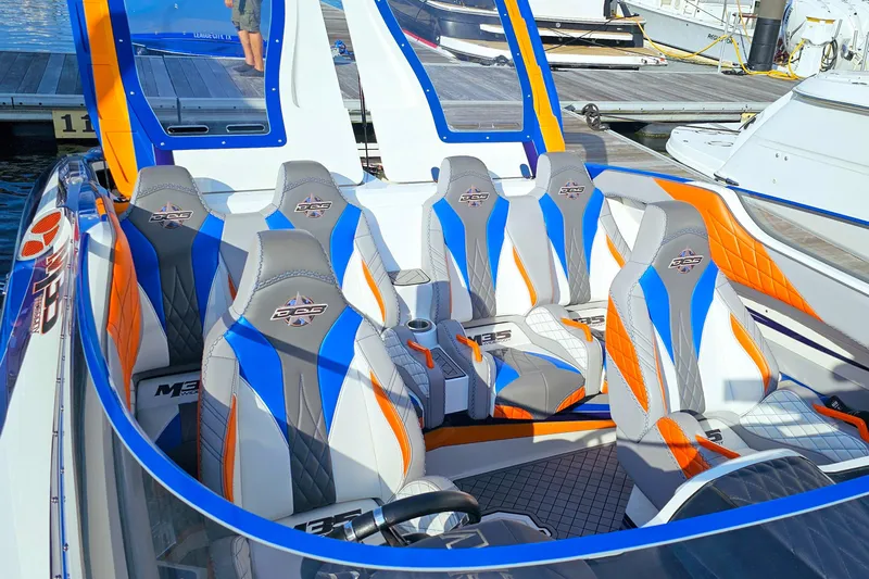  Yacht Photos Pics 2010 Daves Custom Boats M35 with vibrant blue and orange interior at a marina.