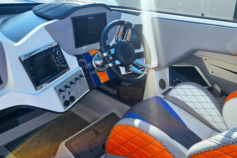  Yacht Photos Pics Interior of 2010 Daves Custom Boats M35, featuring modern dashboard and vibrant seating.