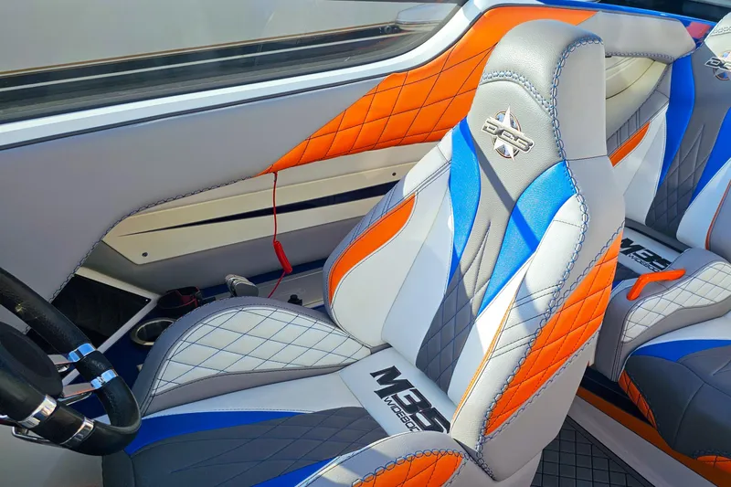  Yacht Photos Pics 2010 Daves Custom Boats M35 interior with vibrant orange, blue, and gray seating design.