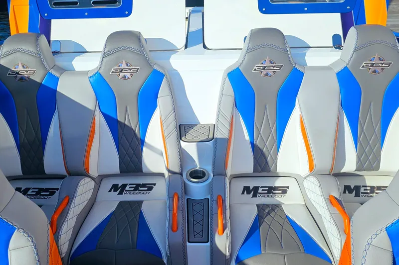 Yacht Photos Pics 2010 Daves Custom Boats M35 interior with blue, gray, and orange seats.
