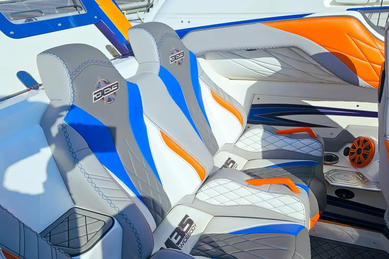  Yacht Photos Pics Luxurious interior of 2010 Daves Custom Boats M35 with vibrant blue and orange seating.