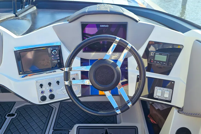  Yacht Photos Pics Steering console of 2010 Daves Custom Boats M35 with modern navigation equipment.