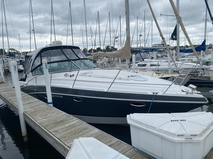 The Mint Yacht Photos Pics 2018 Four Winns 355 Vista yacht docked at marina under cloudy skies.