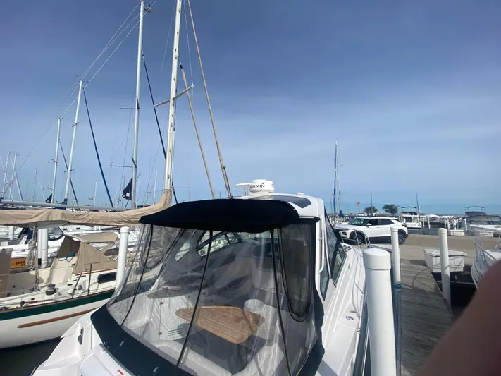 The Mint Yacht Photos Pics 2018 Four Winns 355 Vista yacht docked at marina under clear blue sky.