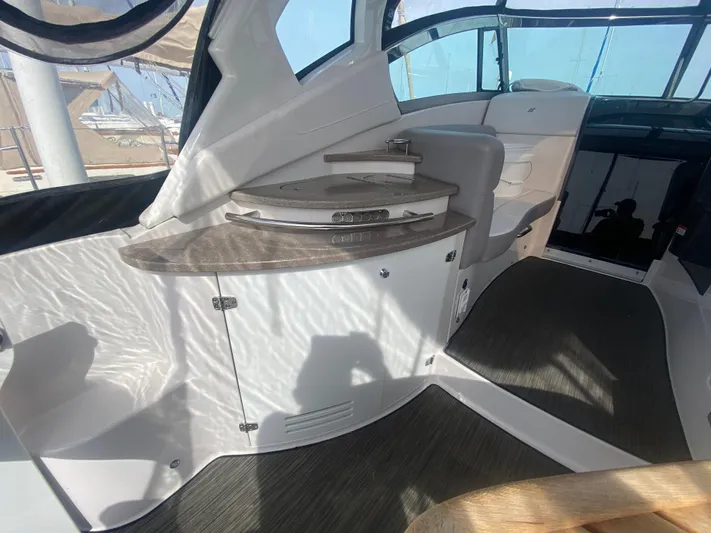 The Mint Yacht Photos Pics Interior of 2018 Four Winns 355 Vista yacht with modern seating and sleek design.