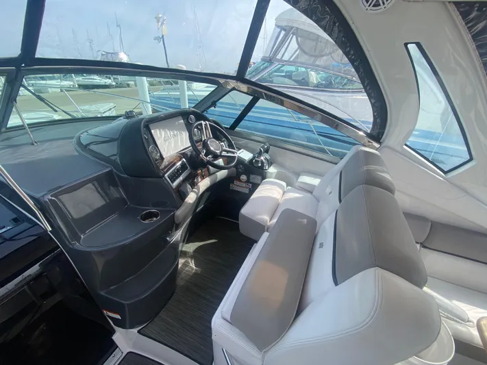 The Mint Yacht Photos Pics Interior of 2018 Four Winns 355 Vista boat with modern helm and seating.