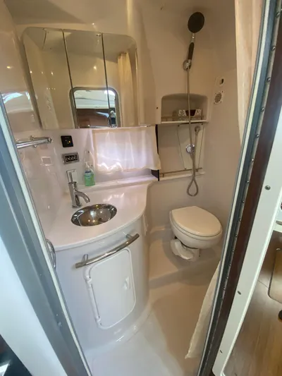 The Mint Yacht Photos Pics 2018 Four Winns 355 Vista boat bathroom with sink, toilet, and shower.