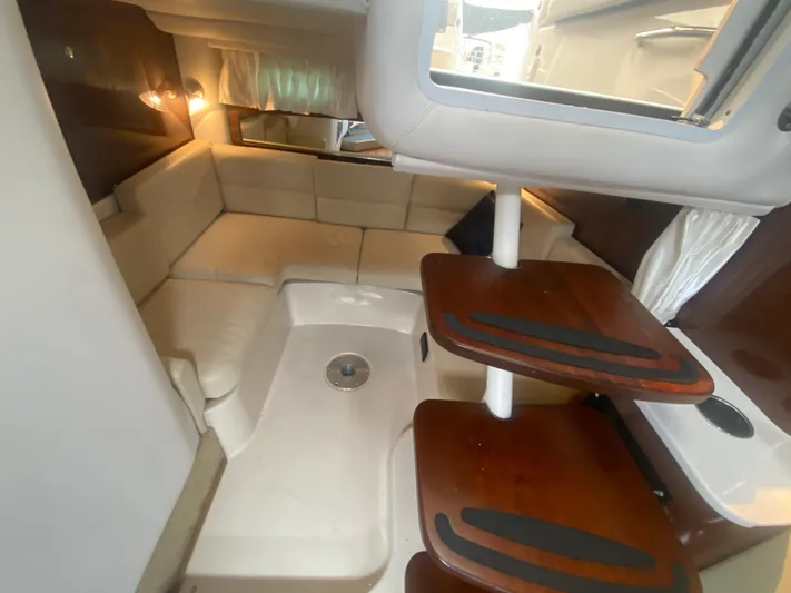 The Mint Yacht Photos Pics Interior of 2018 Four Winns 355 Vista yacht with cozy seating and wooden steps.