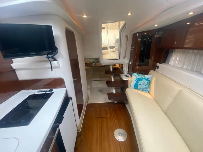 The Mint Yacht Photos Pics Interior of 2018 Four Winns 355 Vista yacht with modern kitchen and seating area.