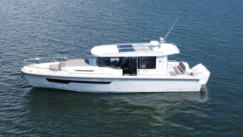 In- Stock 2025 Nimbus C11 #086 Yacht Photos Pics Nimbus Commuter 11 #086, 2025 model, cruising on calm blue waters.