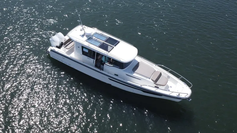 In- Stock 2025 Nimbus C11 #086 Yacht Photos Pics Aerial view of 2025 Nimbus Commuter 11 #086 boat on water.