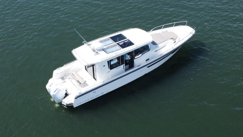 In- Stock 2025 Nimbus C11 #086 Yacht Photos Pics Aerial view of 2025 Nimbus Commuter 11 #086 boat on open water.