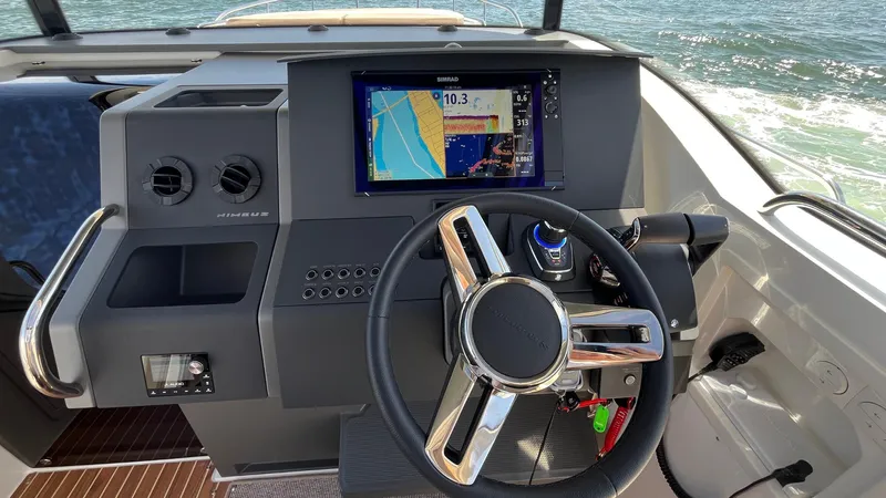 In- Stock 2025 Nimbus C11 #086 Yacht Photos Pics Steering console of 2025 Nimbus Commuter 11 #086 with navigation display.