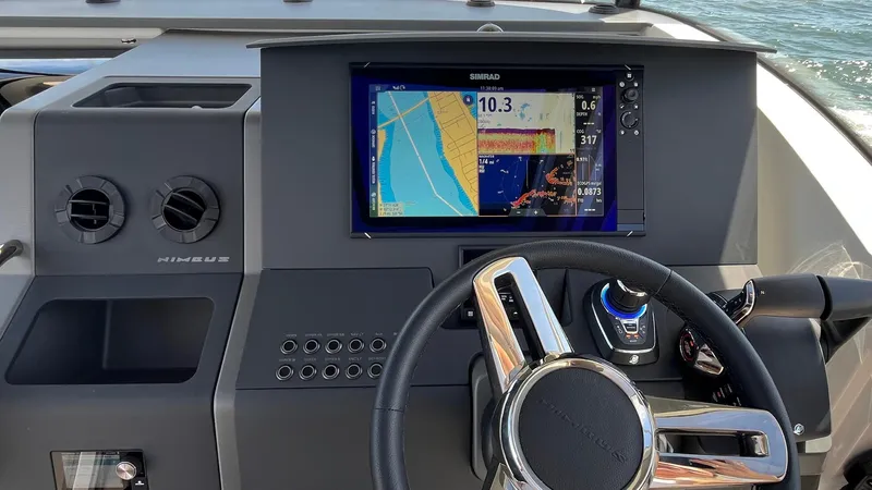 In- Stock 2025 Nimbus C11 #086 Yacht Photos Pics Dashboard of 2025 Nimbus Commuter 11 #086 with navigation display and steering wheel.