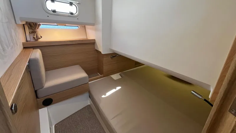 In- Stock 2025 Nimbus C11 #086 Yacht Photos Pics Cozy interior cabin of 2025 Nimbus Commuter 11, featuring modern design and comfortable seating.