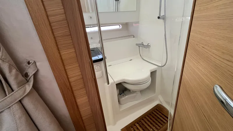In- Stock 2025 Nimbus C11 #086 Yacht Photos Pics Modern bathroom in 2025 Nimbus Commuter 11 #086 with shower and wooden accents.