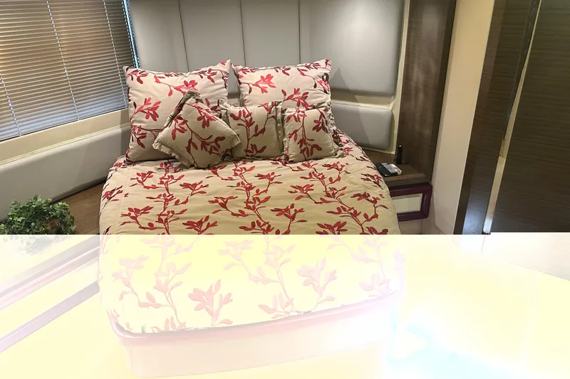 Radio Waves Yacht Photos Pics Luxurious bedroom interior of 2015 Azimut 55S yacht with floral bedding and modern decor.
