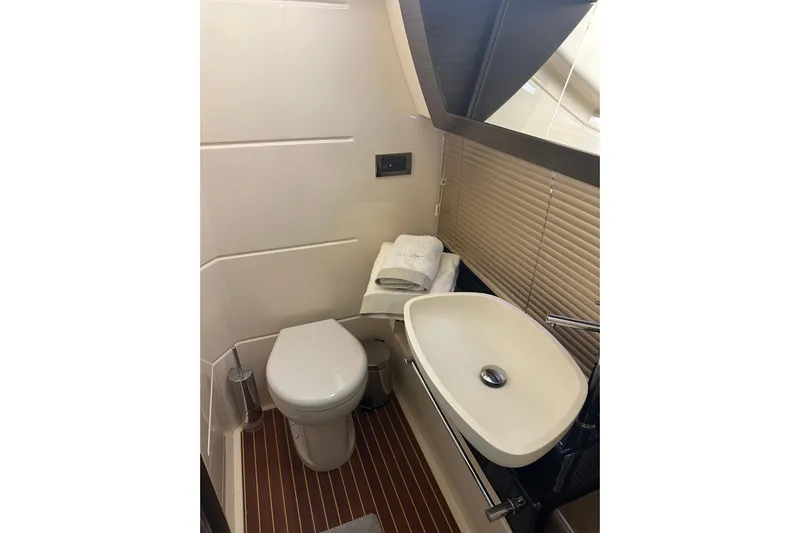 Radio Waves Yacht Photos Pics Luxurious bathroom in 2015 Azimut 55S yacht with modern sink and toilet.