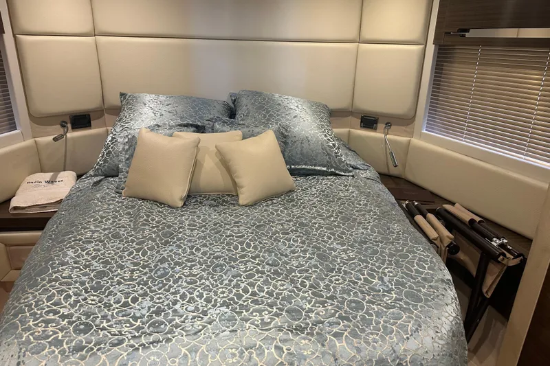 Radio Waves Yacht Photos Pics Luxurious bedroom interior of 2015 Azimut 55S yacht with elegant bedding and decor.