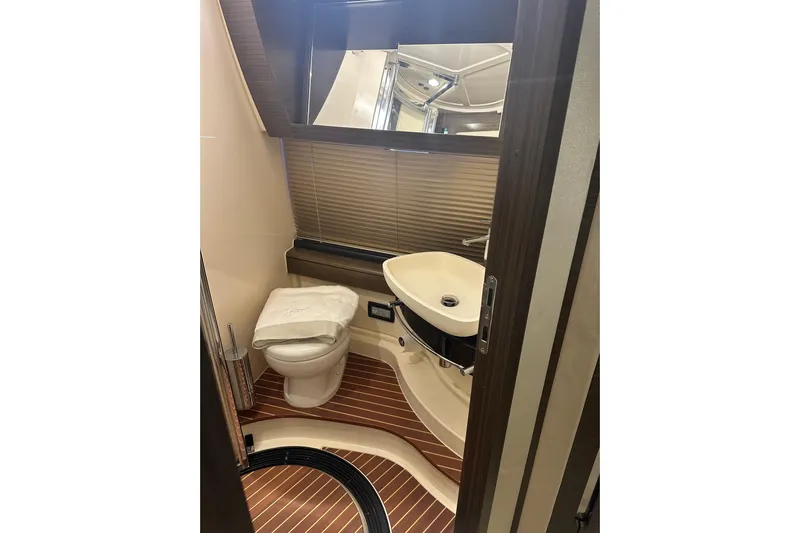 Radio Waves Yacht Photos Pics Luxurious bathroom in 2015 Azimut 55S yacht with modern fixtures and elegant design.