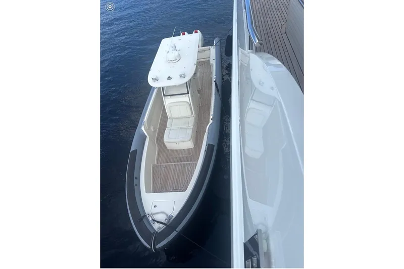  Yacht Photos Pics Aerial view of 2018 Ocean 1 R boat docked beside a larger vessel.