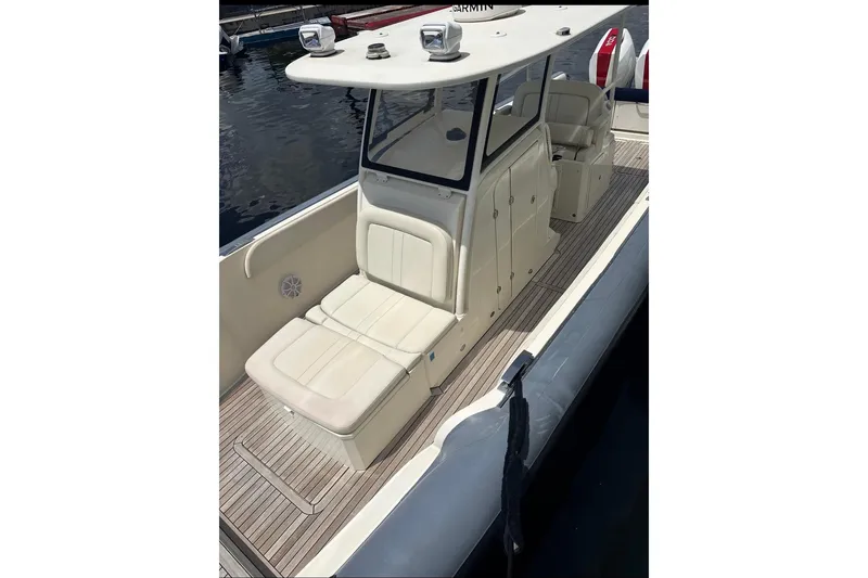  Yacht Photos Pics 2018 Ocean 1 R boat with cushioned seating and sleek design on the water.