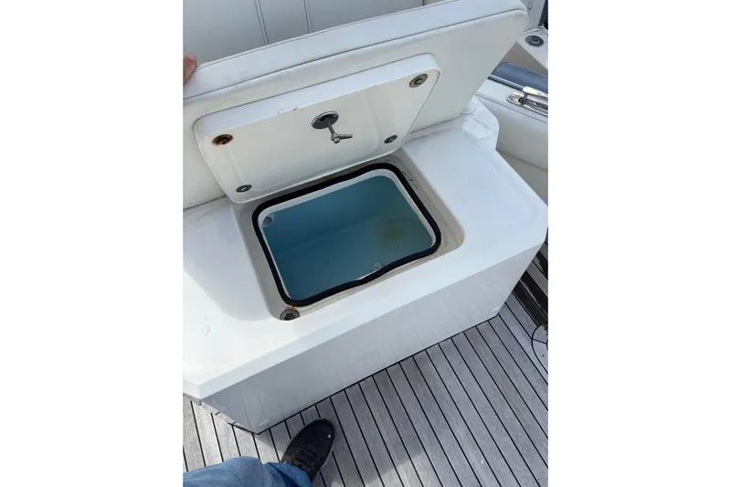  Yacht Photos Pics Open storage compartment on Ocean 1 R boat, 2018 model, with visible interior.