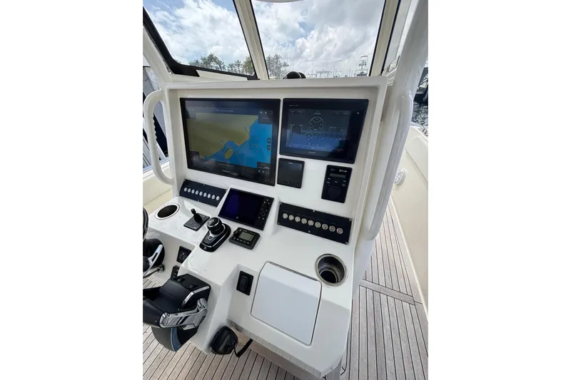  Yacht Photos Pics Control panel of 2018 Ocean 1 R boat with navigation screens and controls.