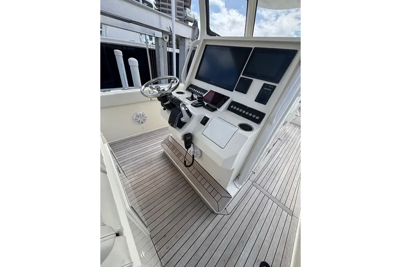  Yacht Photos Pics Control panel of 2018 Ocean 1 R boat with steering wheel and digital displays.