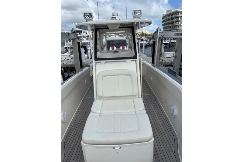 Yacht Photos Pics 2018 Ocean 1 R boat interior with white seating at a marina.