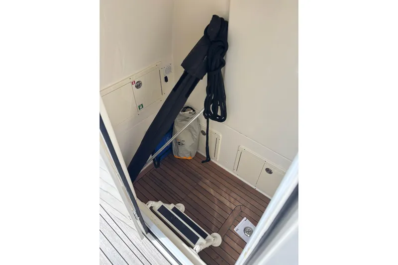  Yacht Photos Pics Interior of 2018 Ocean 1 R boat with wooden flooring and storage compartments.