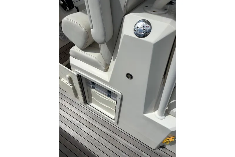  Yacht Photos Pics Interior of 2018 Ocean 1 R boat with white seating and storage compartment.