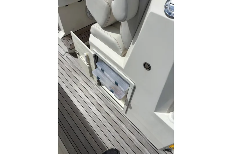 Yacht Photos Pics Boat interior with storage compartment and cushioned seat, Ocean 1 R model, 2018.