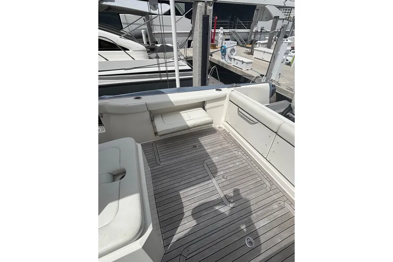  Yacht Photos Pics 2018 Ocean 1 R boat deck with seating, docked at marina.