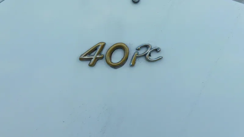  Yacht Photos Pics 2003 Formula 40 PC emblem on white surface, showcasing model identification.