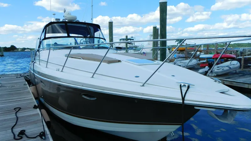  Yacht Photos Pics 2003 Formula 40 PC yacht docked at marina under blue sky.